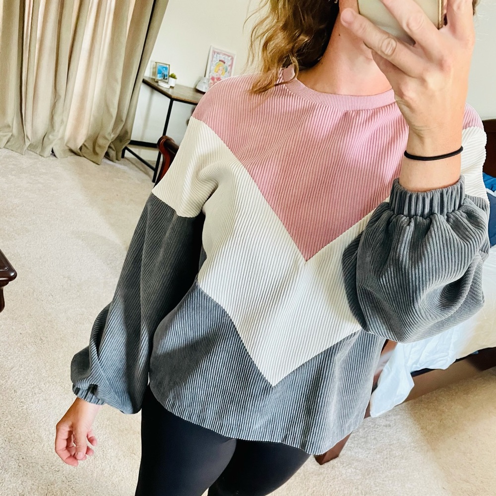 Soft pink, white, and gray corduroy sweater.